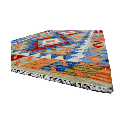 Angled fringe and edge detail of Afghan Chobi Kilim rug showing handwoven wool flatweave and colourful border