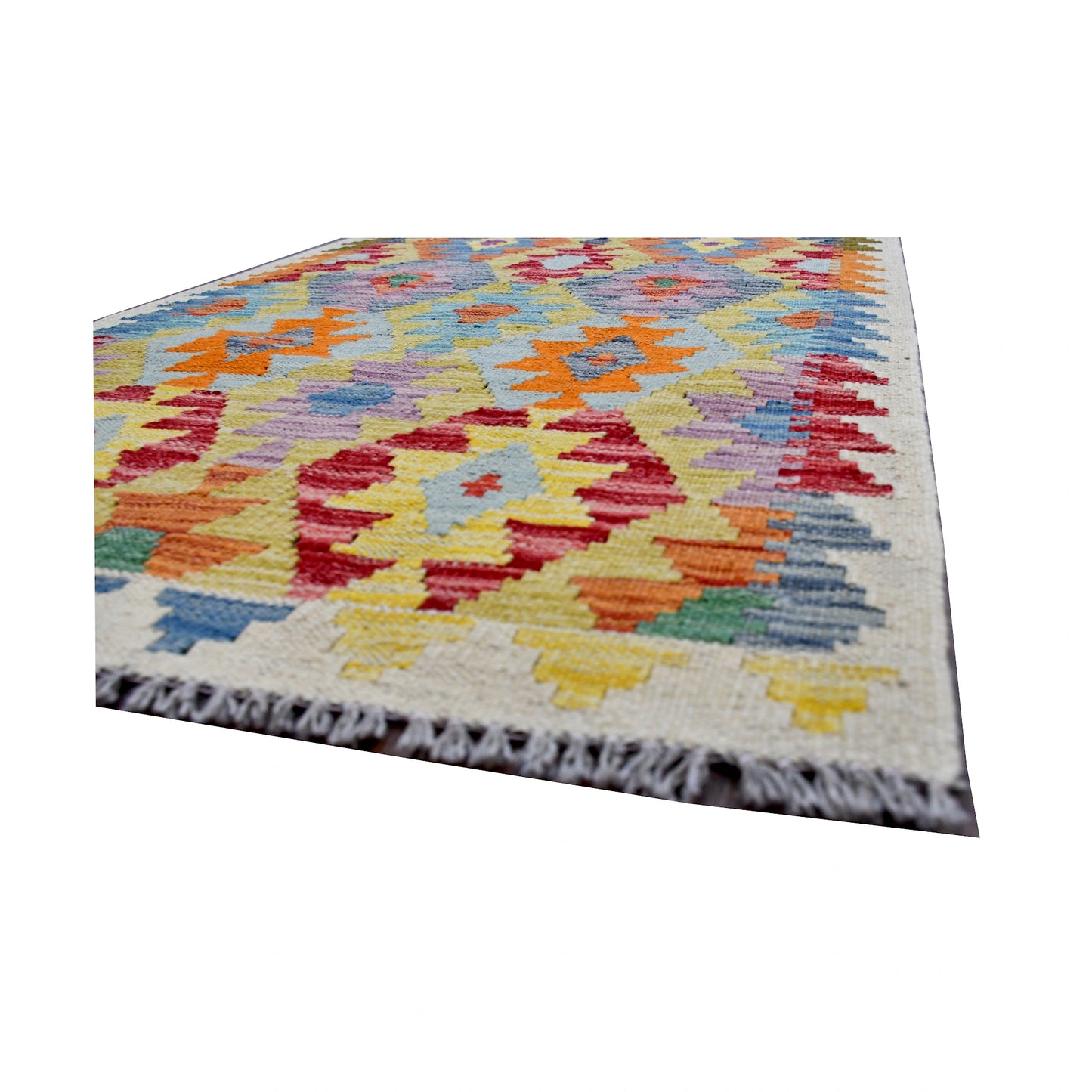 Angled fringe and edge detail of Afghan Chobi Kilim rug showing wool flatweave texture and bright pattern detail
