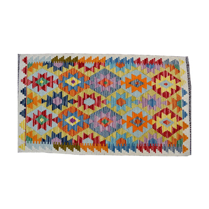 Top view of Afghan Chobi Kilim rug with ivory ground, colourful border and repeated diamond motifs