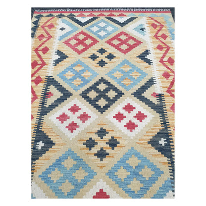 Close-up of Chobi Kilim rug with blue, charcoal, and ivory diamond motifs with tribal accents, 144 x 100 cm