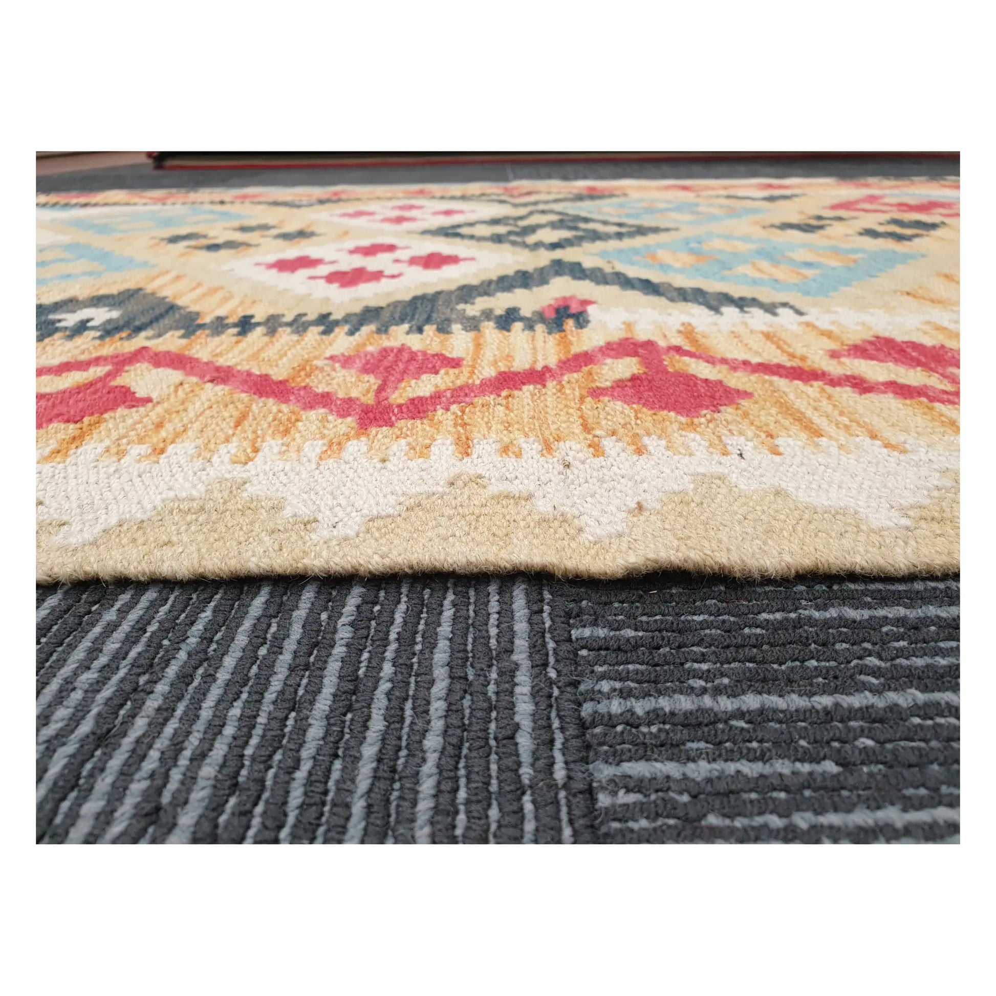 Low-angle close-up of Afghan Chobi Kilim showing wool flatweave texture and geometric border detail, 144 x 100 cm