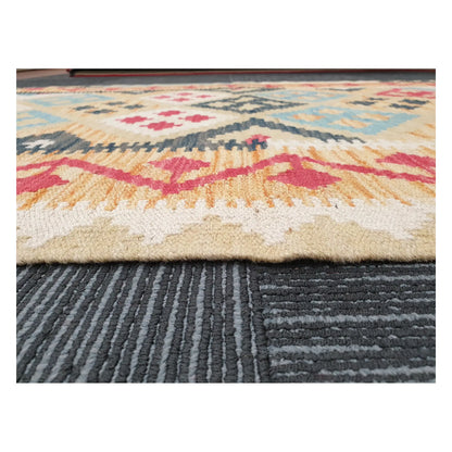 Low-angle close-up of Afghan Chobi Kilim showing wool flatweave texture and geometric border detail, 144 x 100 cm