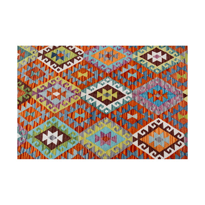 Close-up of Afghan Chobi Kilim geometric pattern with pale aqua, orange, rust and dark brown motifs