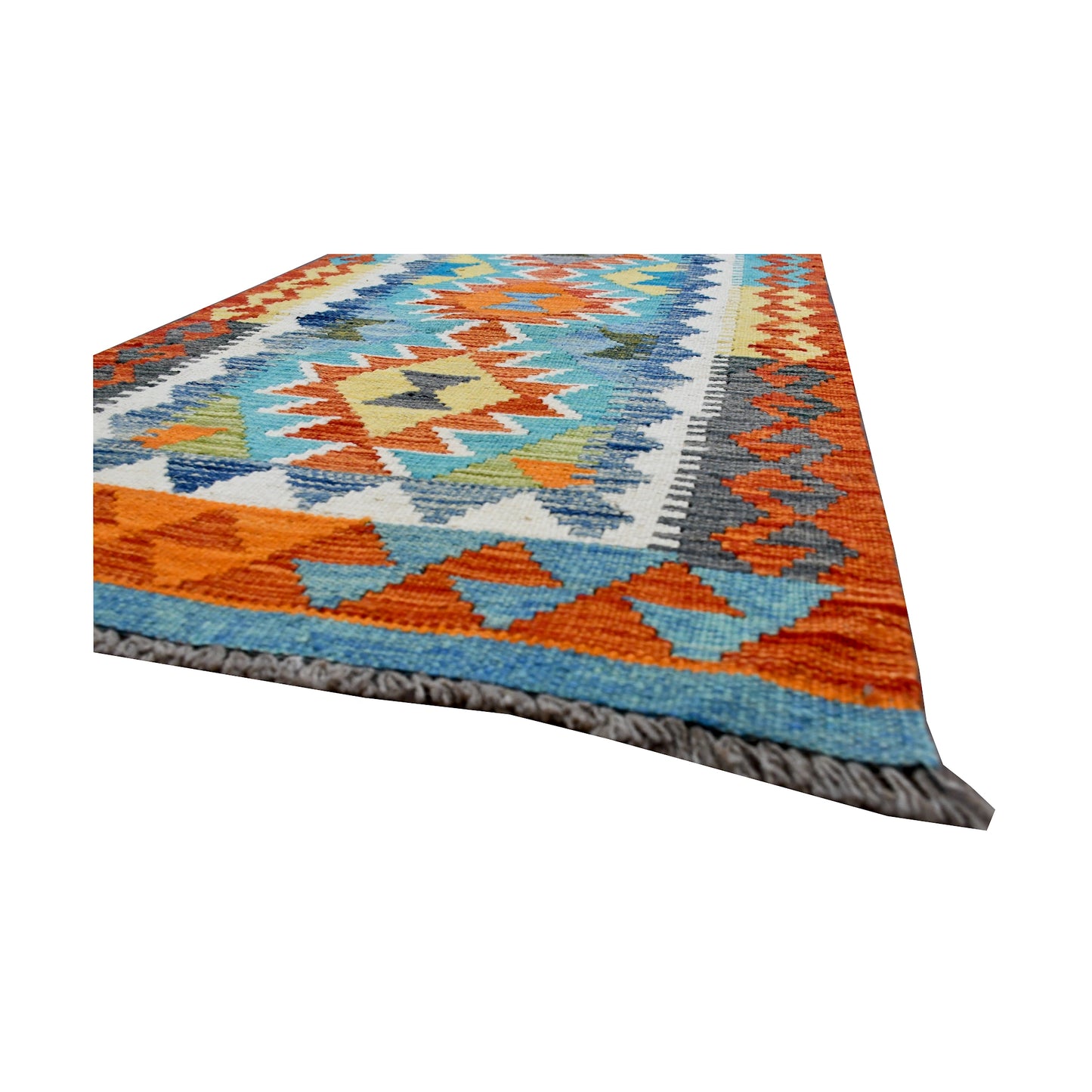 Angled fringe and edge detail of Afghan Chobi Kilim runner showing wool flatweave texture and orange border