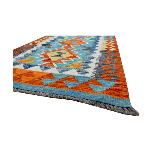 Angled fringe and edge detail of Afghan Chobi Kilim runner showing wool flatweave texture and orange border
