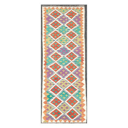 Full view of Afghan Chobi Kilim handwoven wool runner with ivory diamond trellis design, 286 x 77 cm