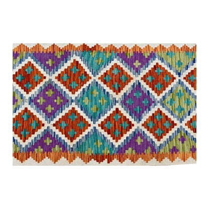 Overhead pattern detail of Afghan Chobi Kilim runner showing coral, turquoise, lilac and sage geometric motifs