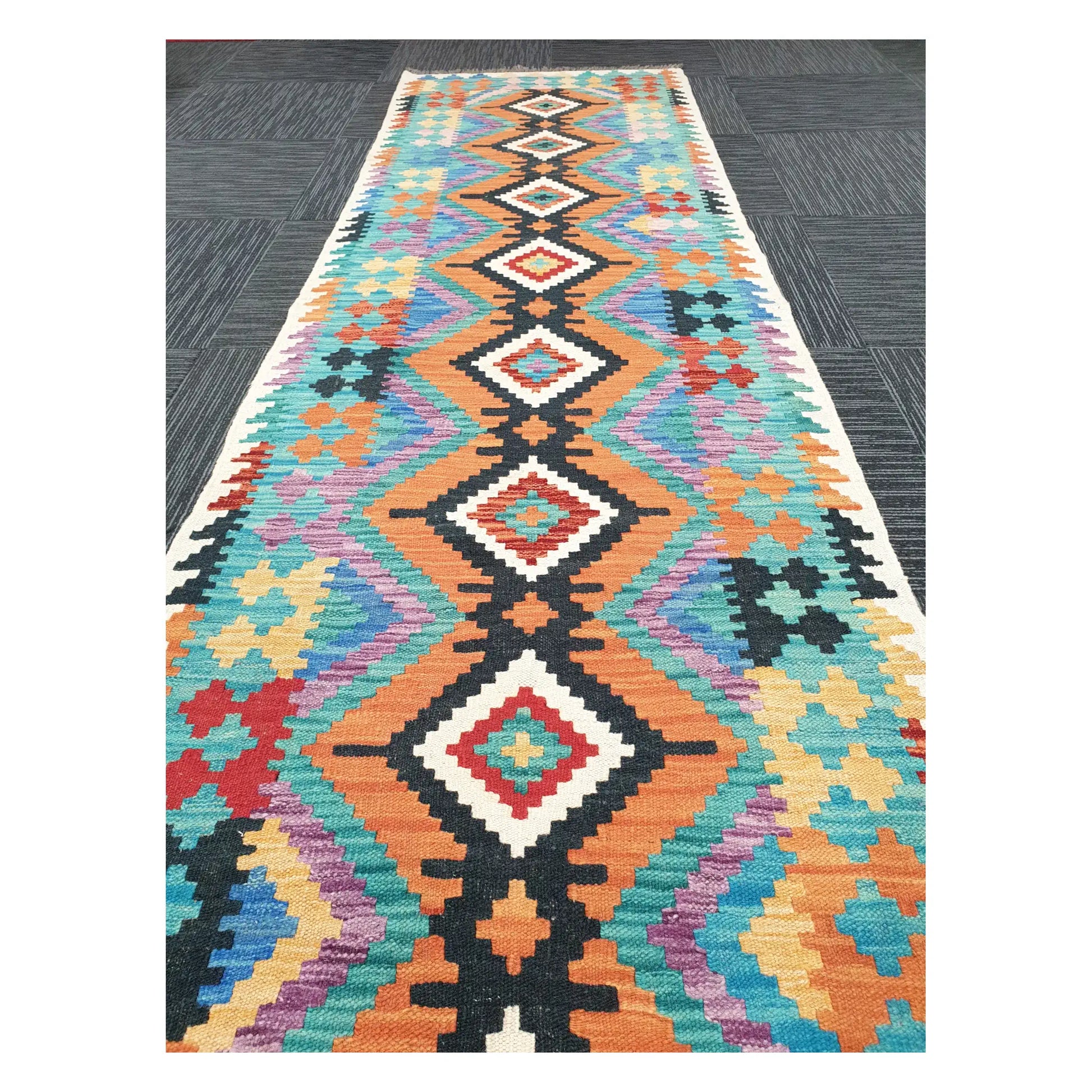 Close runner view of Afghan Chobi Kilim handwoven flatweave with linked diamond chain pattern, 291 x 80 cm