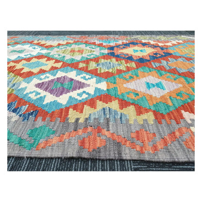 Low-angle close-up of Afghan Chobi Kilim wool flatweave texture and geometric pattern detail, 291 x 81 cm