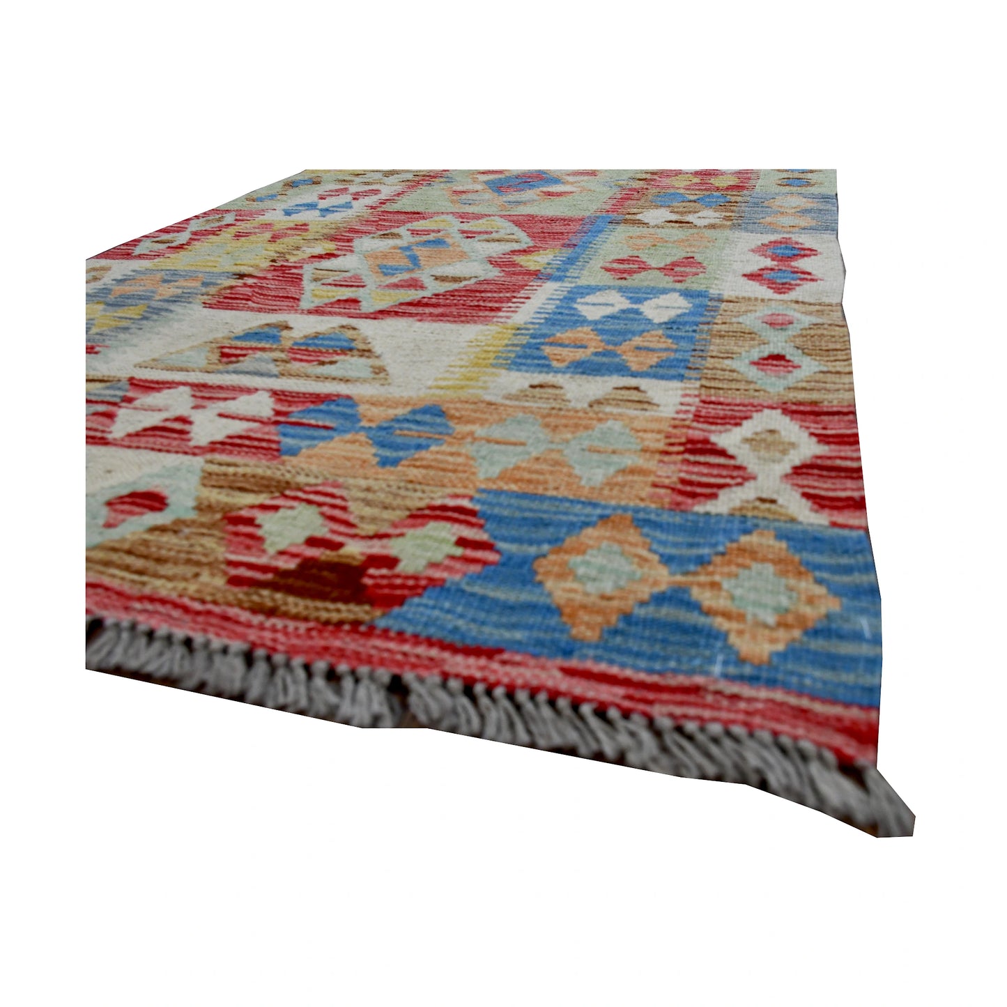 Angled fringe and edge detail of Afghan Chobi Kilim runner showing wool flatweave texture and pastel geometric motifs