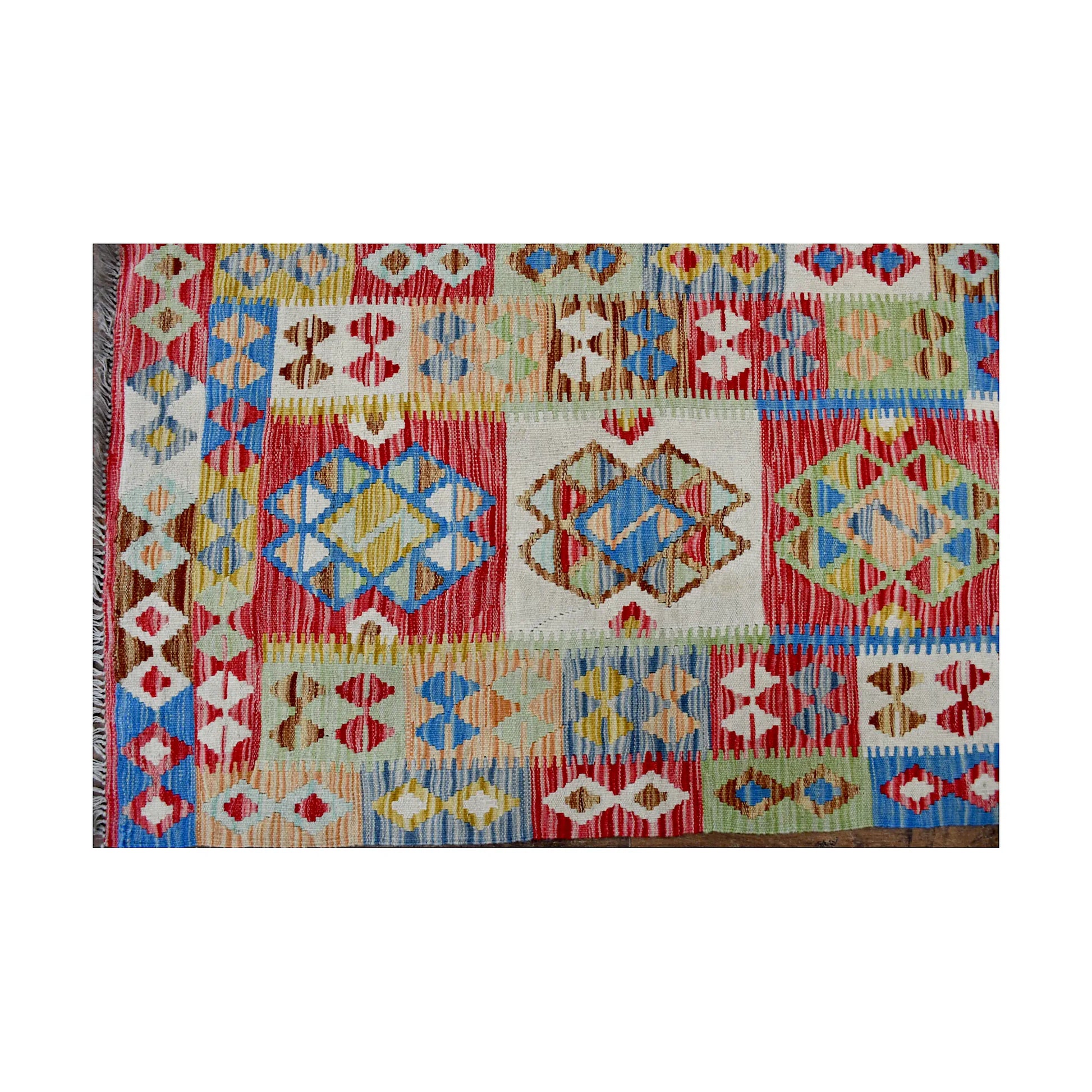 Close-up of Afghan Chobi Kilim runner showing multicolour geometric panels and woven flatweave detail