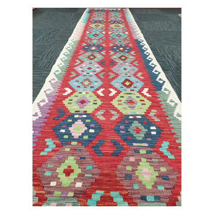 Close runner view of Afghan Chobi Kilim handwoven flatweave with repeating medallion chain design, 386 x 79 cm