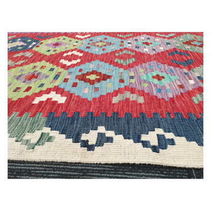 Low-angle close-up of Afghan Chobi Kilim wool flatweave texture and geometric pattern detail, 386 x 79 cm