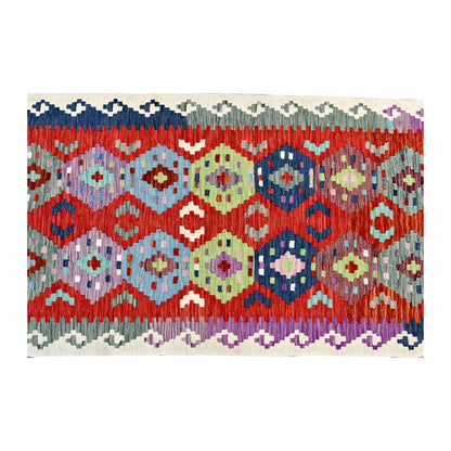 Overhead field detail of Afghan Chobi Kilim runner showing sky-blue, sage, yellow, navy and lilac medallions across the coral-red ground