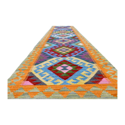Angled full view of Afghan Chobi Kilim runner showing its procession of diamond medallions within orange borders