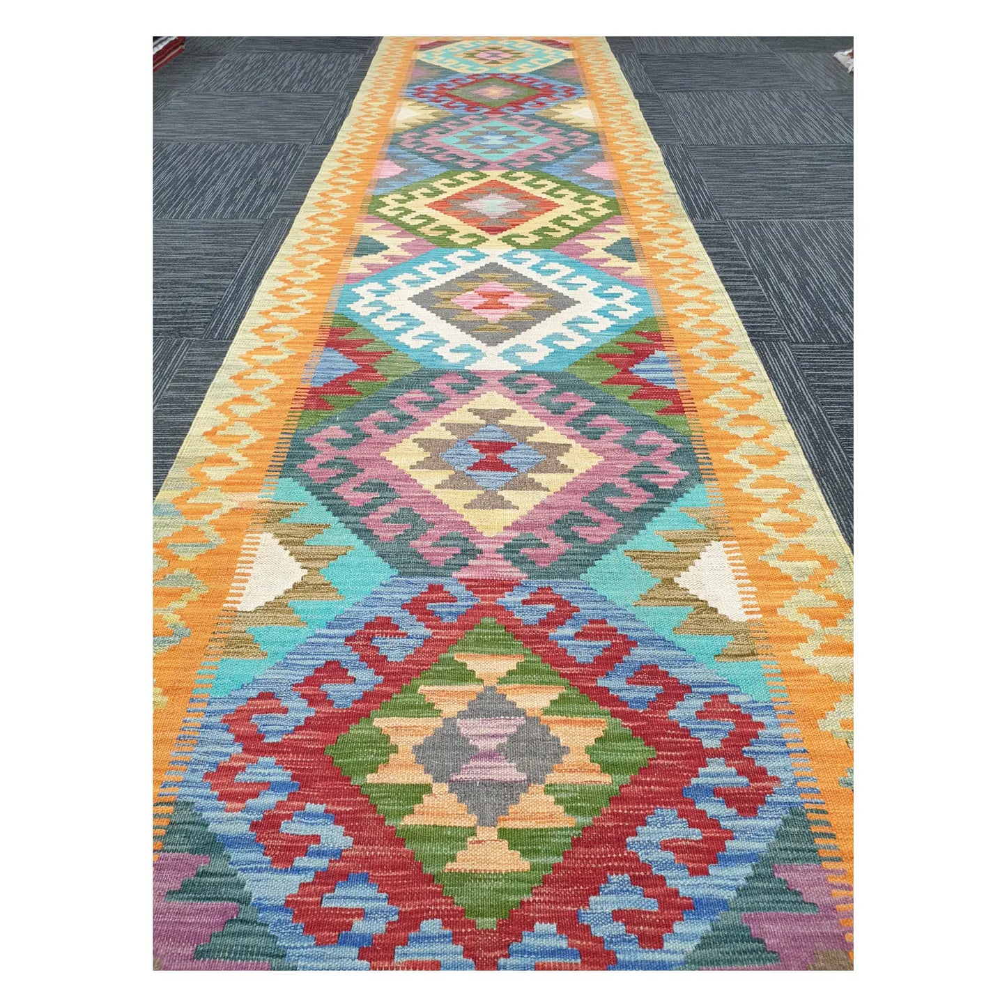 Close runner view of Afghan Chobi Kilim handwoven flatweave with repeating medallion column design, 386 x 86 cm