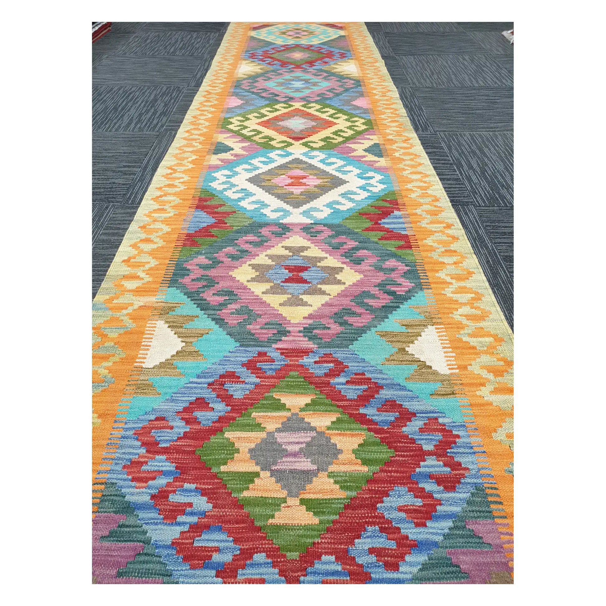 Close runner view of Afghan Chobi Kilim handwoven flatweave with repeating medallion column design, 386 x 86 cm