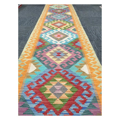 Close runner view of Afghan Chobi Kilim handwoven flatweave with repeating medallion column design, 386 x 86 cm