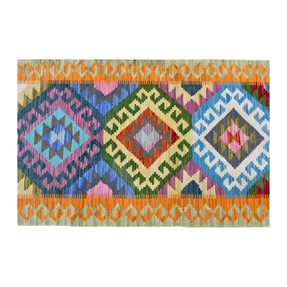 Overhead field detail of Afghan Chobi Kilim runner showing blue, green, yellow and pink medallions between orange linked borders