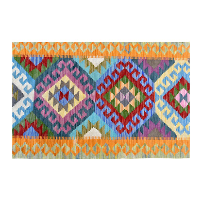 Overhead field detail of Afghan Chobi Kilim runner showing pink, coral and blue diamond medallions between orange linked borders