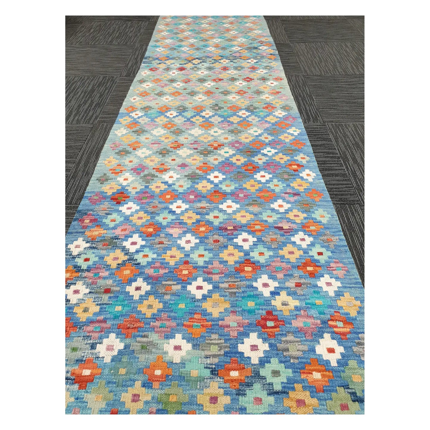 Close runner view of Afghan Chobi Kilim handwoven wool flatweave with floral diamond grid design, 303 x 80 cm