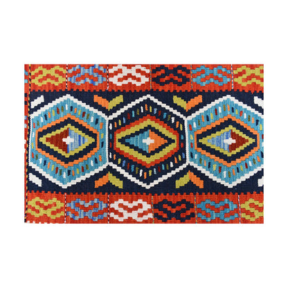 Close-up of Afghan Chobi Kilim wool rug showing colourful diamond medallions and stepped geometric pattern