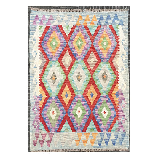 Full view of Afghan Chobi Kilim wool rug with prismatic diamond trellis on an ivory ground, 115 x 86 cm