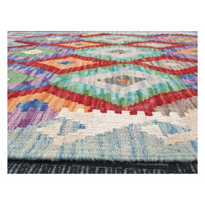 Low-angle close-up of Afghan Chobi Kilim showing wool flatweave texture and geometric pattern detail, 115 x 86 cm