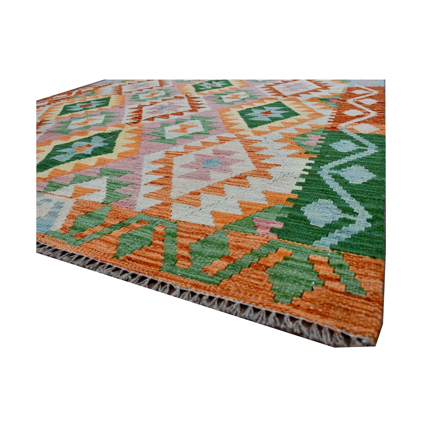 Angled fringe and edge detail of Afghan Chobi Kilim wool rug showing flatwoven texture, green motifs and orange border