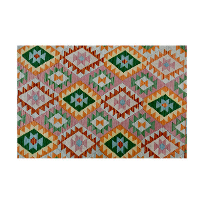 Pattern detail of Afghan Chobi Kilim wool rug with repeated green diamond motifs on an ivory geometric field