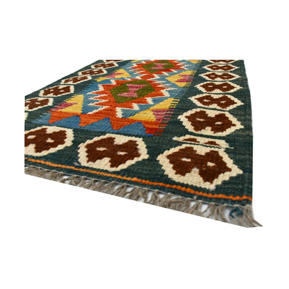 Angled fringe and flatweave detail of Afghan Chobi Kilim wool rug showing teal, rust, ivory and dark green geometric pattern