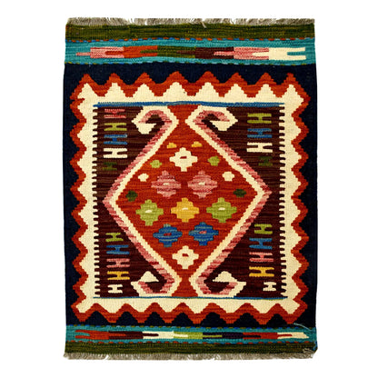 Afghan Chobi Kilim wool rug 87 x 58 cm full view with burgundy frame, rust diamond medallion and fringe