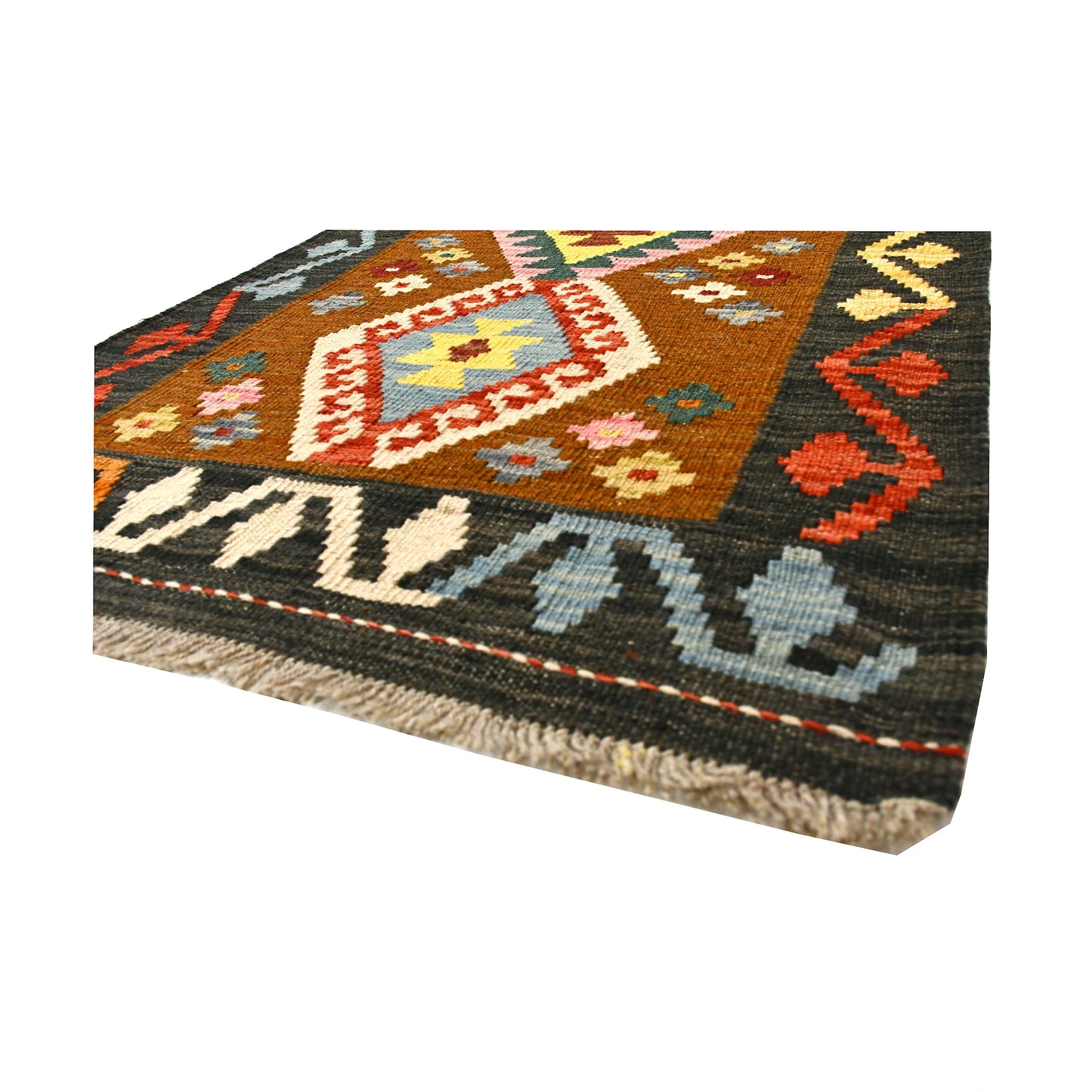 Angled fringe and flatweave detail of Afghan Chobi Kilim wool rug showing rust brown, ivory, orange and charcoal geometry