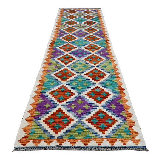Full view of Afghan Chobi Kilim wool runner with a multicoloured diamond trellis on an ivory ground, 286 x 77 cm