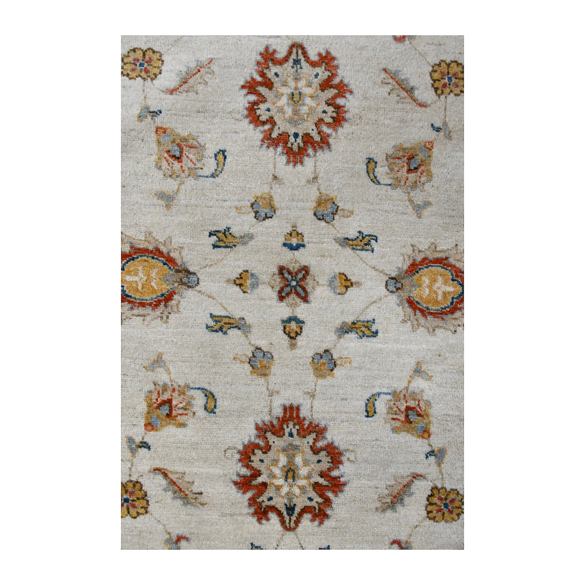 Close-up of Afghan Chobi rug with rust-red rosettes, muted gold blossoms and soft blue-green accents