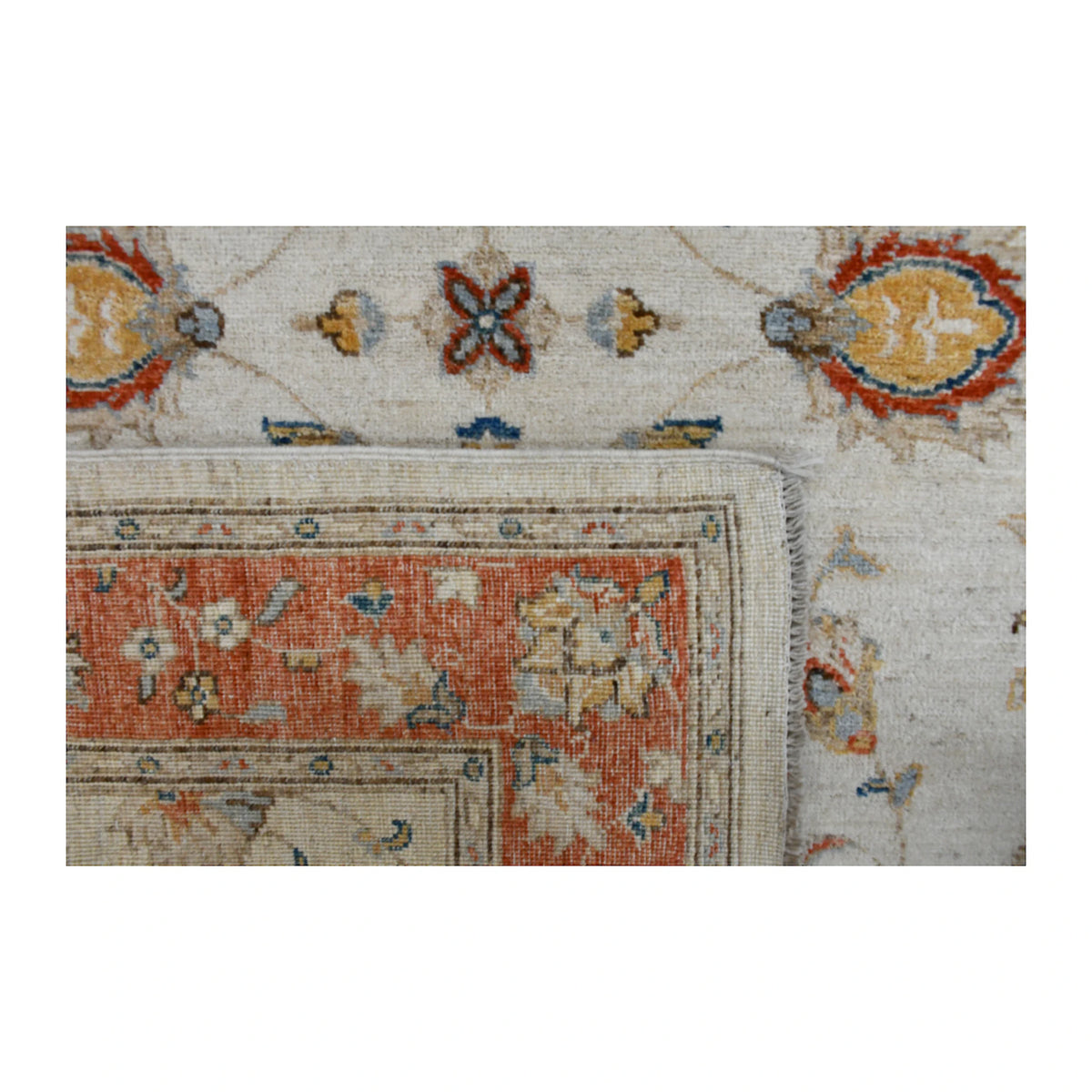 Folded-corner detail of Afghan Chobi rug showing the front pattern, reverse weave and finished edge