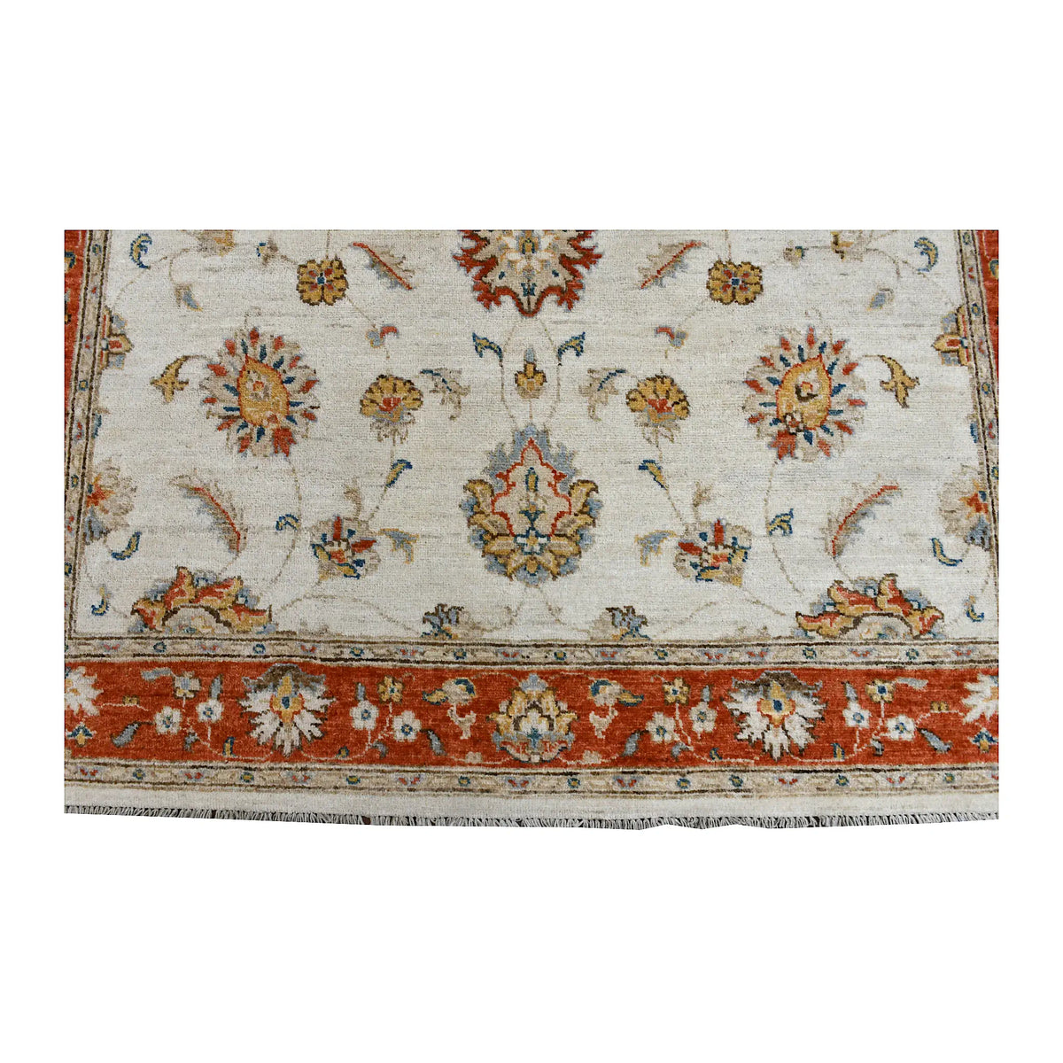 Fringe and end-border detail of Afghan Chobi rug with rust-red floral borderwork and soft blue-green accents