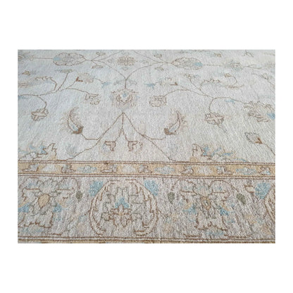 Border detail of Afghan Chobi soft beige rug showing pale blue and beige tones