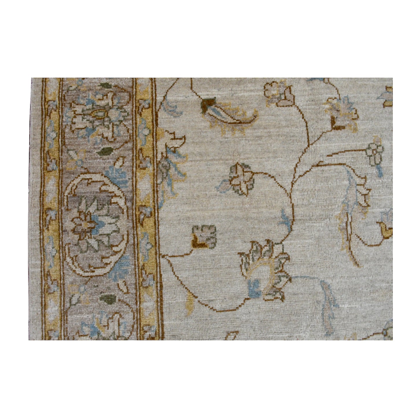 Close-up of Afghan Chobi soft beige rug showing the pale blue and gold floral border beside the open field with delicate vine motifs