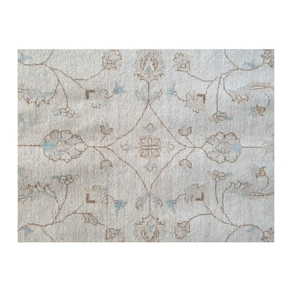 Field detail of Afghan Chobi soft beige rug showing subtle floral motifs