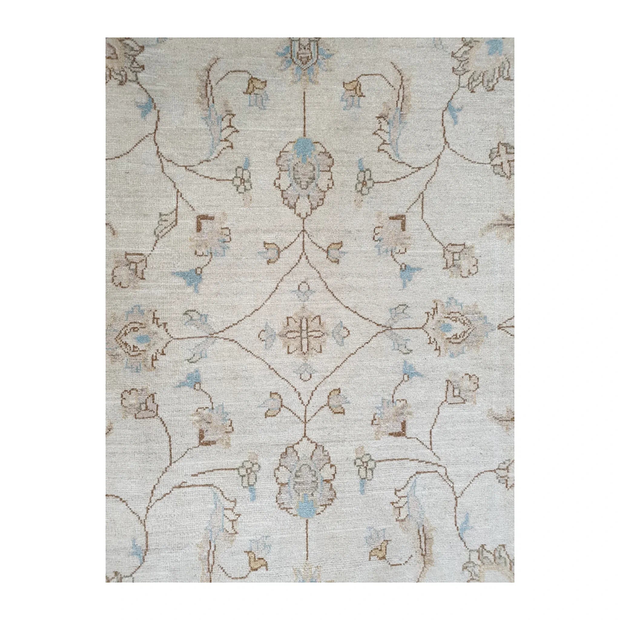 Load video: Afghan Chobi hand-knotted wool rug shown from multiple angles, highlighting its soft beige floral pattern, subtle blue accents and wool texture.