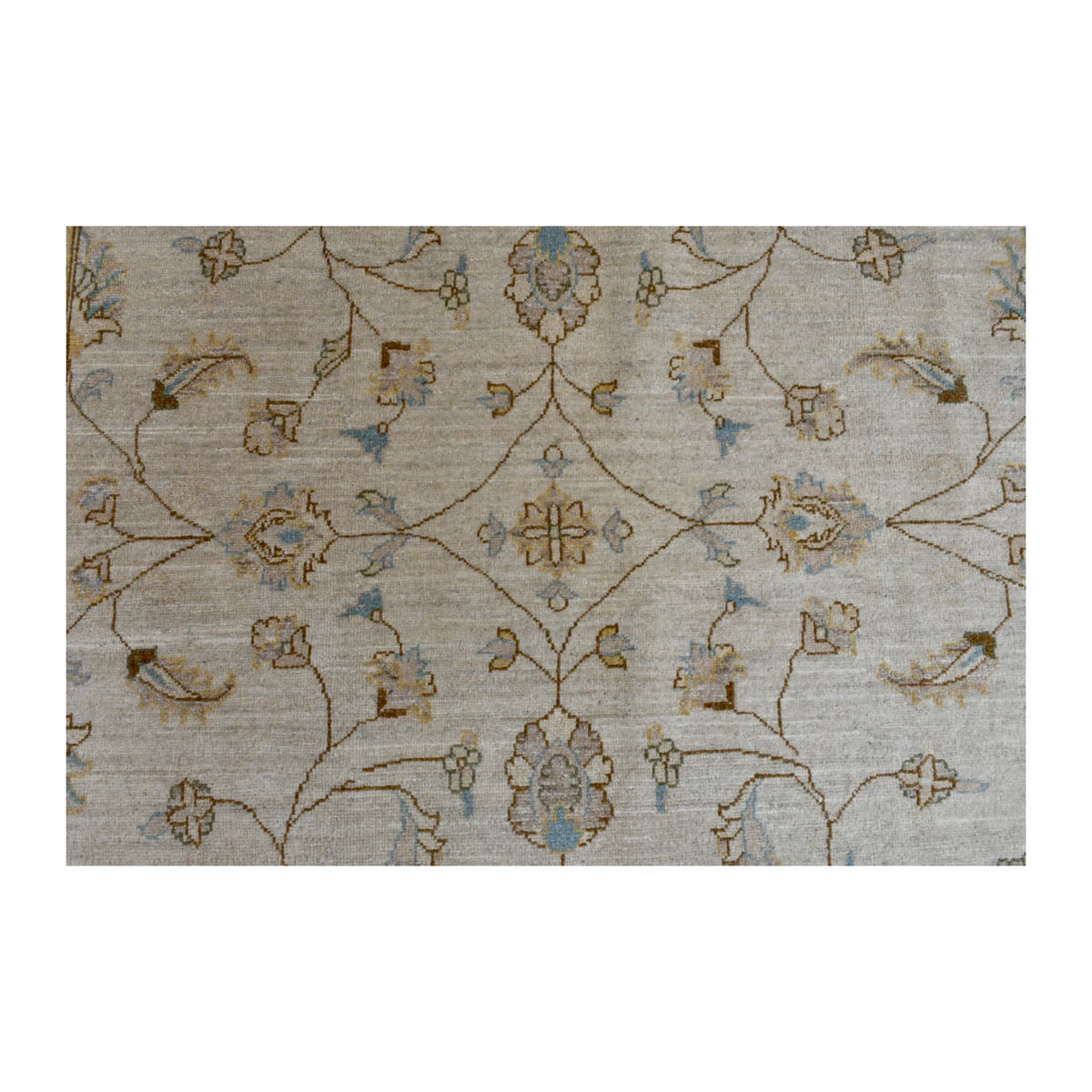 Field detail of Afghan Chobi rug showing symmetrical floral-vine motifs across the soft beige field