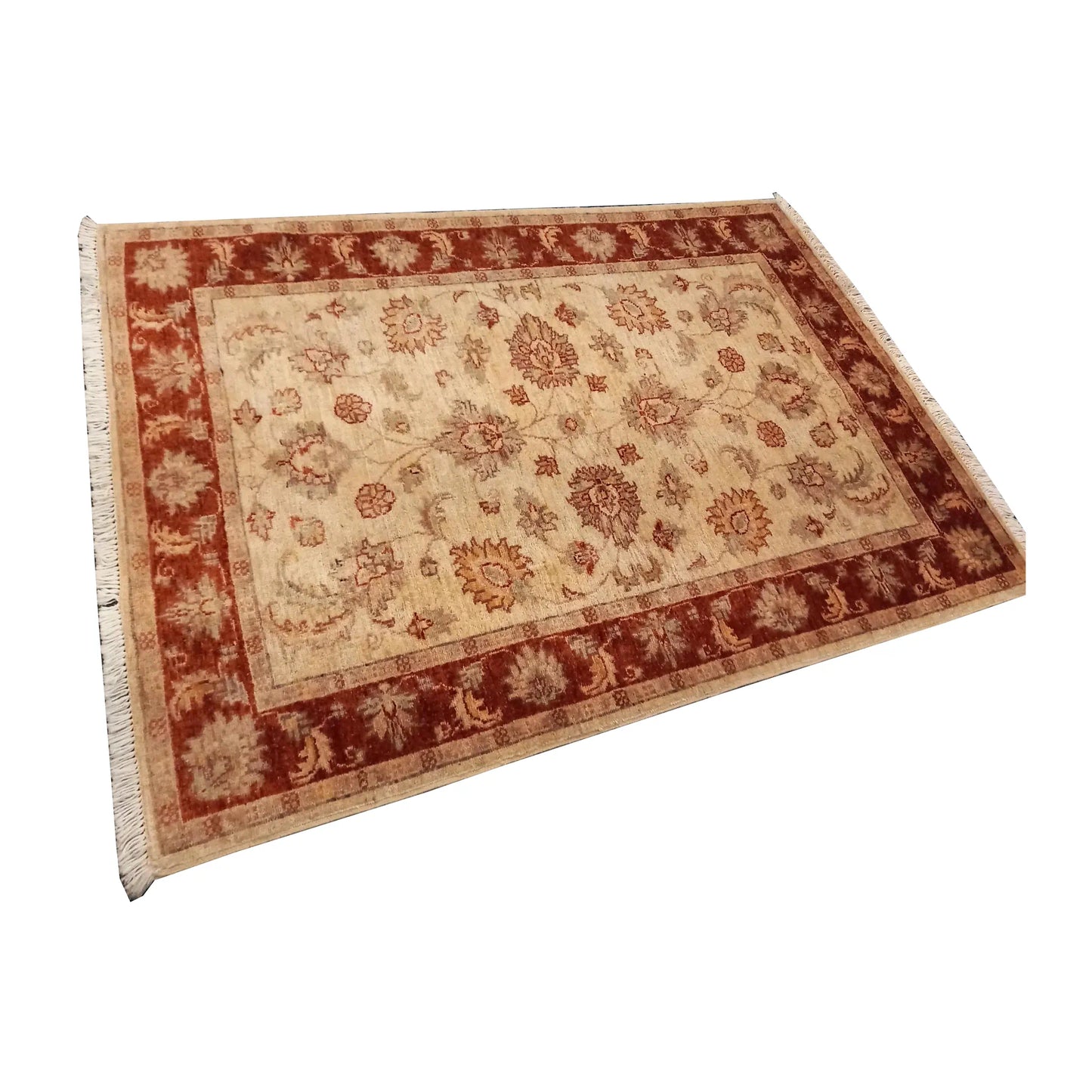 Angled full view of the Afghan Chobi rug showing its open floral field and broad rust-red border
