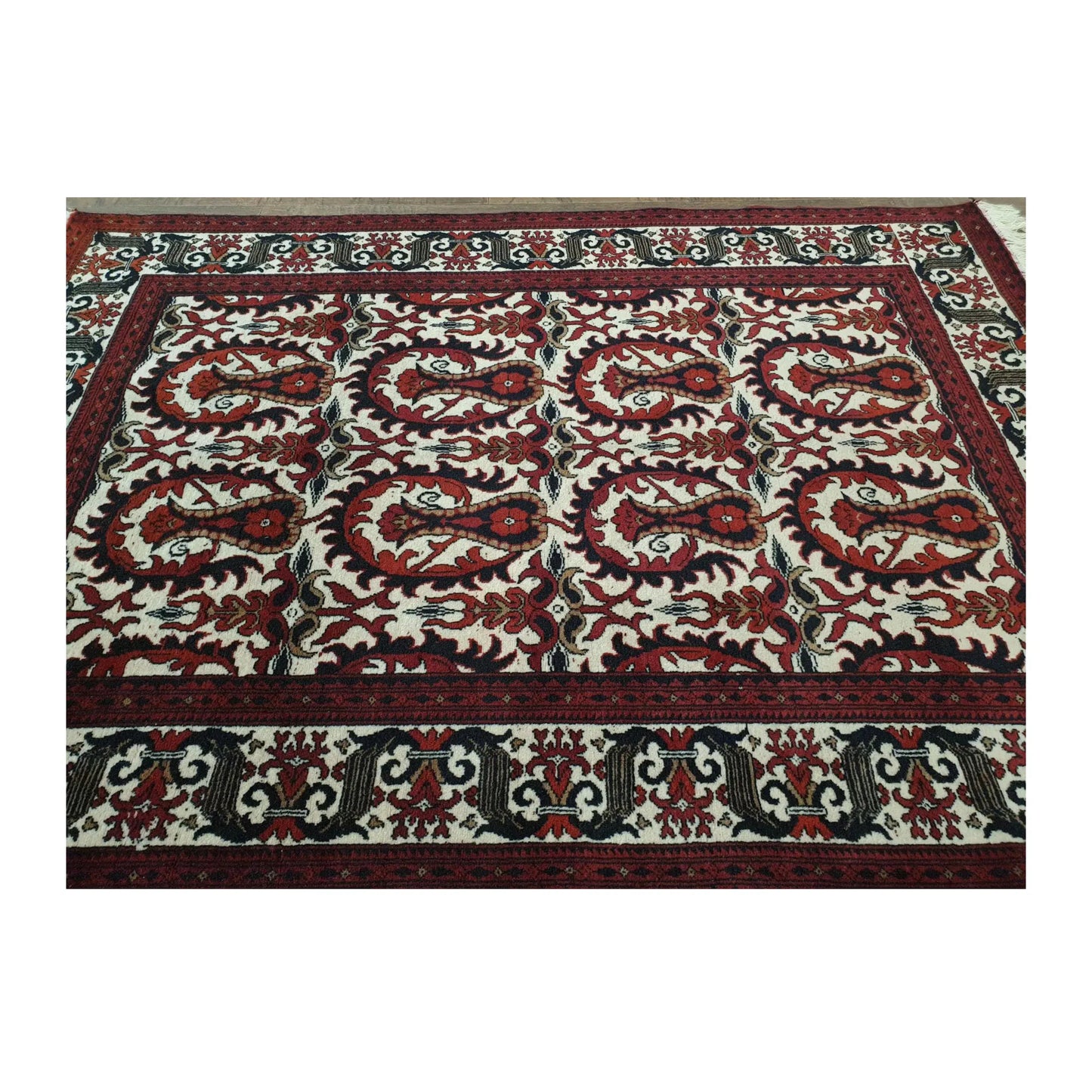 Angled view of Afghan Ersari Fine hand-knotted wool rug showing red field, repeated motifs and border detail, 155 x 104 cm