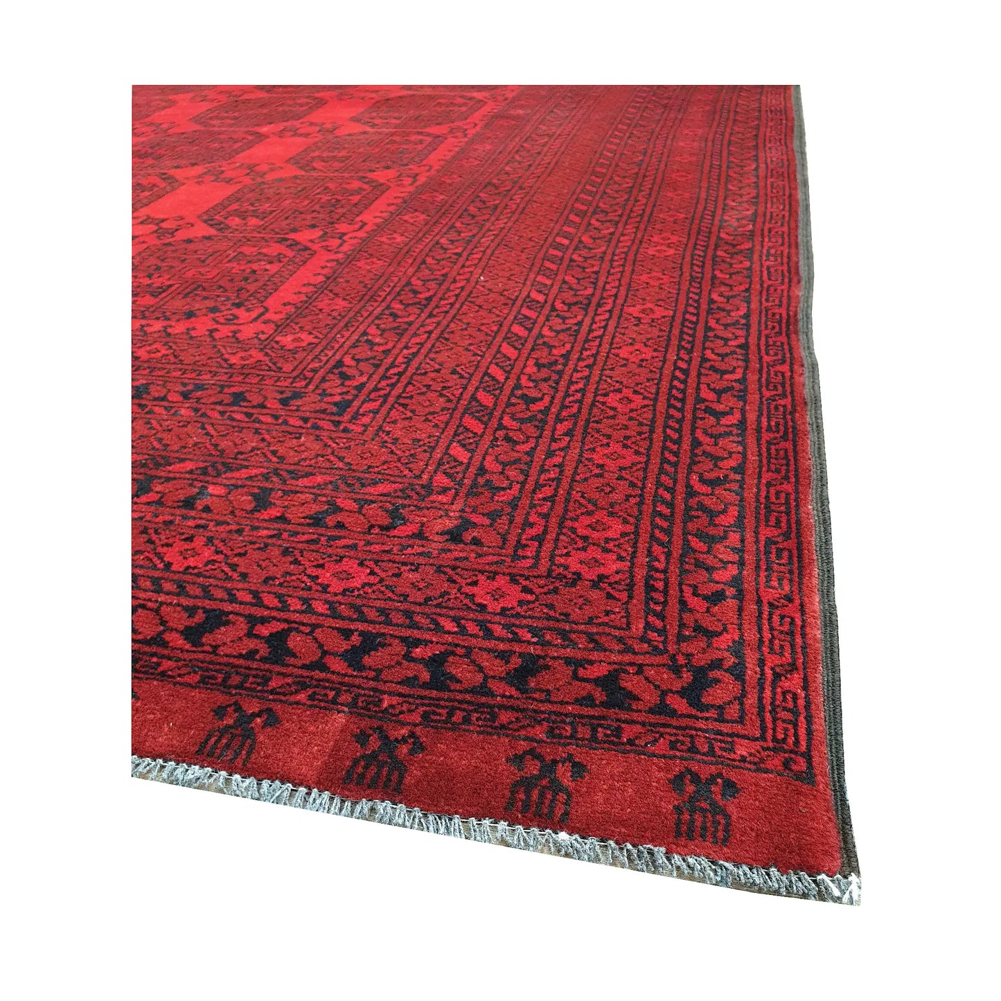 Angled border and fringe detail of Afghan Ersari rug showing deep red wool pile, dark tribal edging and geometric pattern