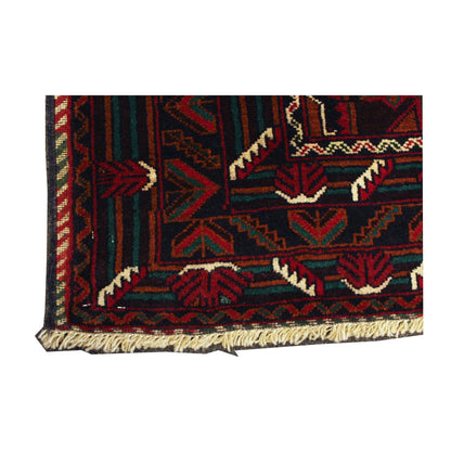 Corner detail of Afghan Fine Baluchi rug showing the patterned end border and visible fringe