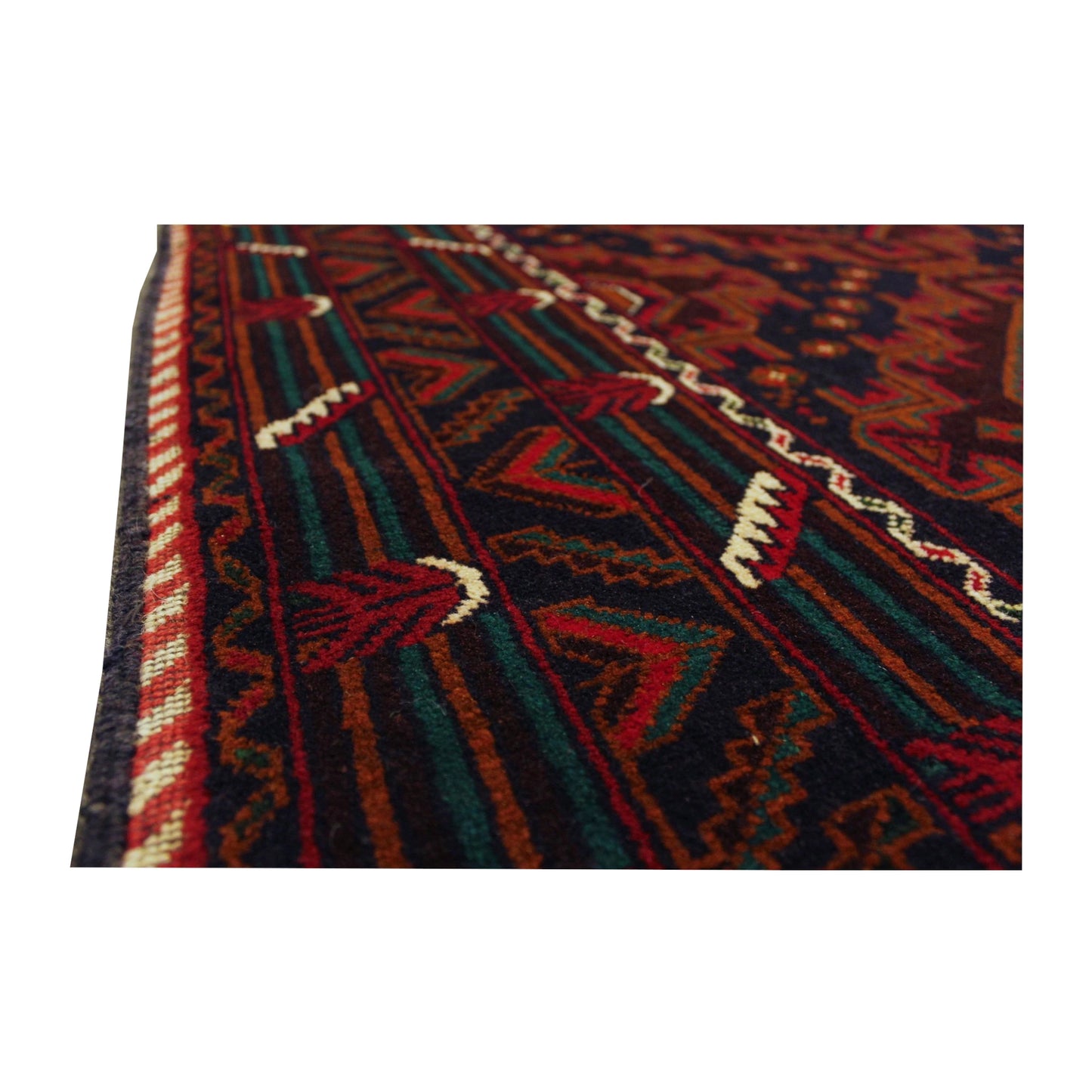 Angled close-up of Afghan Fine Baluchi rug showing the layered side border with red, black and muted teal geometric details