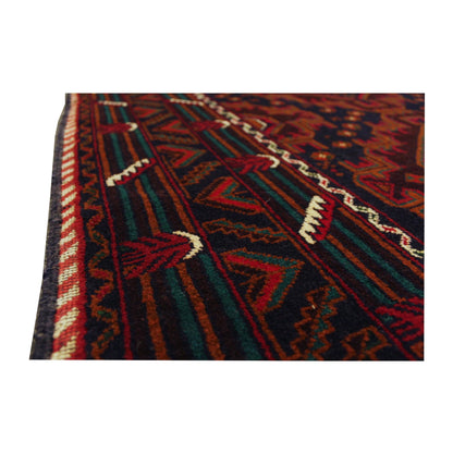 Angled close-up of Afghan Fine Baluchi rug showing the layered side border with red, black and muted teal geometric details