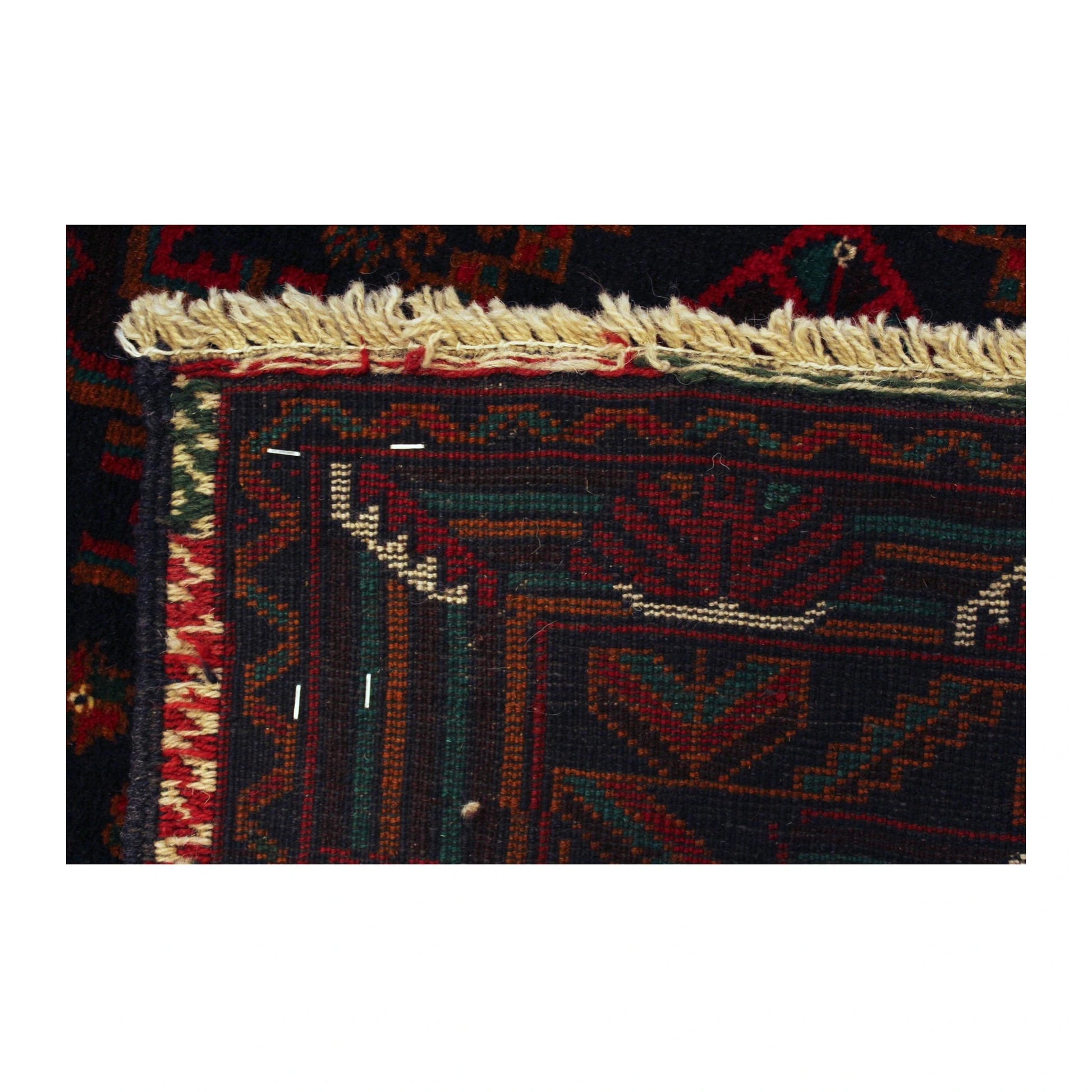 Reverse-weave end detail of Afghan Fine Baluchi rug showing the handmade structure, end border and visible fringe