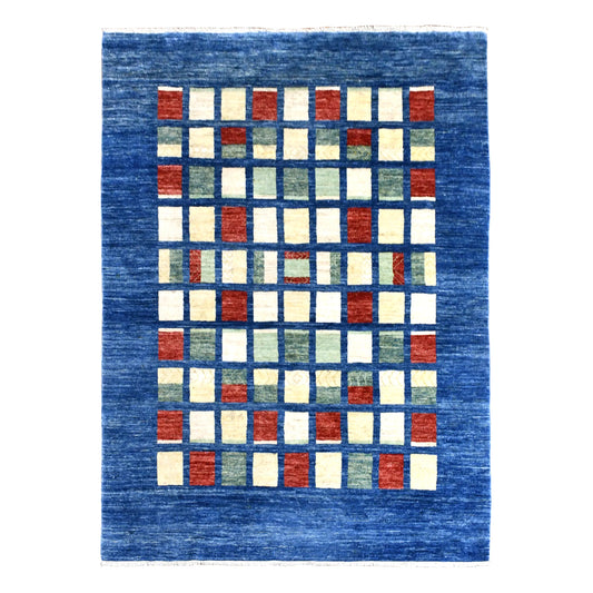 Full view of blue Afghan Gabbeh rug with a central grid of ivory, rust and sage rectangles, 270 x 208 cm